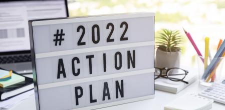 2022 action plan text on light box on desk table in office.Business motivation or management.