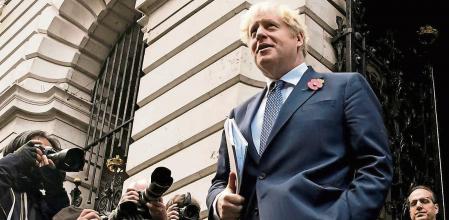 British Prime Minister Boris Johnson and Principal Private Secretary to the Prime Minister Martin Reynolds leave after a cabinet meeting at the Foreign and Commonwealth Office (FCO) in London, Britain November 10, 2020. Picture taken November 10, 2020. REUTERS/Toby Melville
