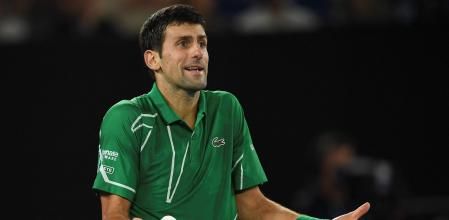 (FILES) This file photo taken on February 2, 2020 shows Serbia's Novak Djokovic reacting after a point against Austria's Dominic Thiem during their men's singles final match on day fourteen of the Australian Open tennis tournament in Melbourne. - Novak Djokovic lost his bid to avoid deportation from Australia on January 16, 2022, with a Federal Court unanimously rejecting his appeal to stay in the country and defend his Australian Open title. (Photo by Greg WOOD / AFP) / -- IMAGE RESTRICTED TO EDITORIAL USE - STRICTLY NO COMMERCIAL USE --