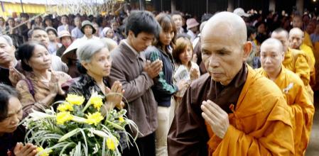 SOC SON, VIET NAM: Zen Buddhist monk leader Thich Nhat Hanh (F) prays during a three-day requiem for the souls of Vietnam War victims held 20 April 2007 at a pagoda in Soc Son district, suburban Hanoi. The monk has held two others requiems in Southern and Central Vietnam. AFP PHOTO/HOANG DINH Nam (Photo credit should read HOANG DINH NAM/AFP via Getty Images
