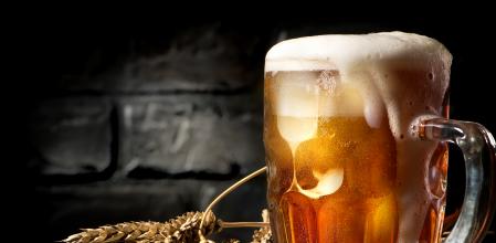 Light beer and wheat near brick wall