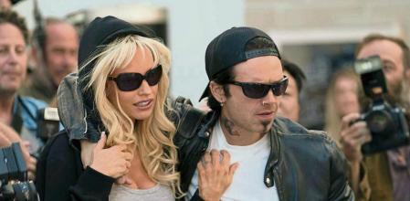 This image released by Hulu shows Sebastian Stan, right, and Lily James in the series 