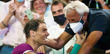 MELBOURNE, AUSTRALIA - JANUARY 30: Rafael Nadal of Spain celebrates with his father Sebastian Nadal after winning his Menâ#{emoji}128;#{emoji}153;s Singles Final match against Daniil Medvedev of Russia during day 14 of the 2022 Australian Open at Melbourne Park on January 30, 2022 in Melbourne, Australia. (Photo by Mark Metcalfe/Getty Images)