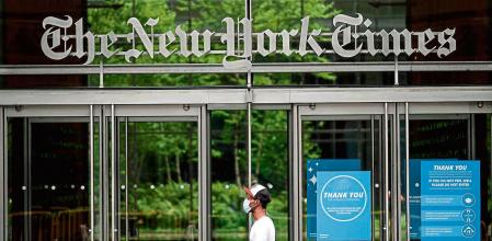 The New York Times building is seen on June 30, 2020 in New York City. - The New York Times has become the highest-profile media organization to leave Apple News, saying the tech giant's service was not helping achieve the newspaper's subscription and business goals. The daily's exit comes as news organizations around the world struggle with declining print readership and an online environment where ad revenue is dominated by Google and Facebook. (Photo by Johannes EISELE / AFP)
