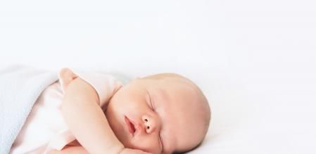 Newborn baby sleep first days of life. Cute little newborn child sleeping peacefully