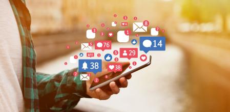 Man receives notifications on smart phone