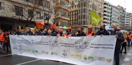 Pancarta en la manifestación del campo valenciano el 25 de febrero de 2022