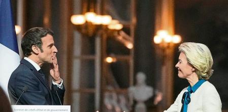 French President Emmanuel Macron blows a kiss to European Commission President Ursula von der Leyen after a joint press conference after the EU summit at the Chateau de Versailles, Friday, March 11, 2022 in Versailles, west of Paris. The European Union says it will continue applying pressure on Russia by devising a new set of sanctions to punish Moscow for its invasion of Ukraine while stepping up military support for Kyiv. (AP Photo/Michel Euler)