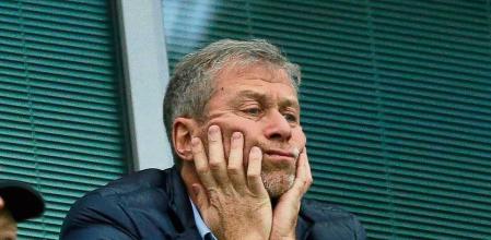 FILE - Chelsea soccer club owner Roman Abramovich sits in his box before their English Premier League soccer match against Sunderland at Stamford Bridge stadium in London, Dec. 19, 2015.Unpreceded restrictions have been placed on Chelsea’s ability to operate by the British government after owner Roman Abramovich is targeted in sanctions. Abramovich is among seven wealthy Russians who had their assets frozen by the government. It freezes his ability to sell Chelsea which was announced last week after Russia invaded Ukraine. (AP Photo/Matt Dunham, File)