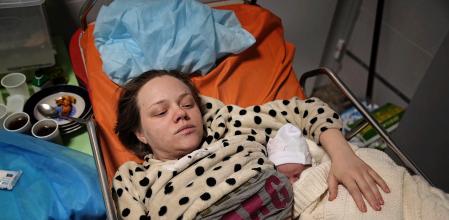 Mariana Vishegirskaya lies in a hospital bed after giving birth to her daughter Veronika, in Mariupol, Ukraine, Friday, March 11, 2022. Vishegirskaya survived the Russian airstrike on a children’s and maternity hospital in Mariupol last Wednesday. (AP Photo/Evgeniy Maloletka)