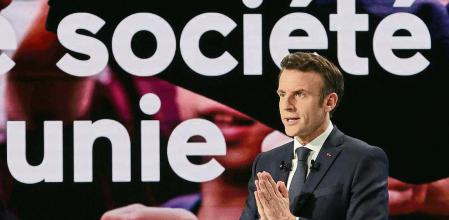 French President Emmanuel Macron, candidate for his re-election in the 2022 French presidential election, speaks during a news conference to unveil his presidential program at Les Docks de Paris, in Aubervilliers near Paris, France, March 17, 2022. REUTERS/Pascal Rossignol