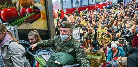 KRAKOW, POLAND - MARCH 15: People who fled the war in Ukraine walk towards a humanitarian train to relocate refugees to Berlin on March 15, 2022 in Krakow, Poland. More than half of the roughly 3 million Ukrainians fleeing war have crossed into neighbouring Poland since Russia began a large-scale armed invasion of Ukraine on February 24, 2022. (Photo by Omar Marques/Getty Images)