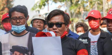 MANDALAY, MYANMAR - 2021/02/23: San Nyein Oo who is from the Poet union reads a Statement of condolence from the poet union to Thet Naing Win who was shot dead by the Myanmar Security Forces during the military coup protests. Thousands gather at Kyarnikan cemetery in Mandalay for the funeral of Thet Naing Win who was shot dead by Myanmar security forces on Saturday during the Military coup protests. (Photo by Kaung Zaw Hein/SOPA Images/LightRocket via Getty Images)