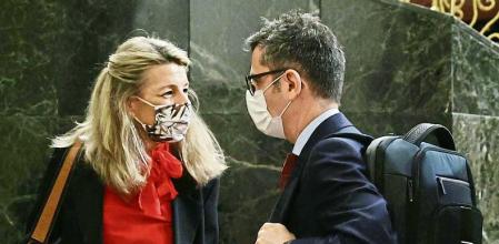 MADRID, SPAIN - FEBRUARY 02: (L-R) The spokesman of the Socialist Parliamentary Group, Hector Gomez; the second vice-president of the Government and Minister of Labour and Social Economy, Yolanda Diaz; and the Minister of the Presidency, Relations with the Courts and Democratic Memory, Felix Bolaños, talk after participating in a plenary session in the Congress of Deputies, on 02 February, 2022 in Madrid, Spain. In today's plenary session, they discuss, among other issues, whether the Ministry of Defense has considered sending additional military personnel in the event of a military conflict in Ukraine; the consequences of the Labour reform for the Spanish agricultural sector; and the draft bill of the Housing Law. (Photo By Eduardo Parra/Europa Press via Getty Images)