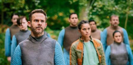 Dominic Monaghan as Paul Sarno, Emma McDonald as Bella Sway and Mooners - Moonhaven _ Season 1, Episode 3 - Photo Credit: Szymon Lazewski/AMC