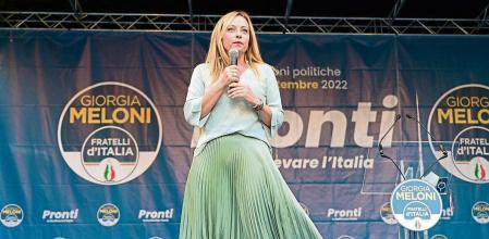 Leader of Italian far-right party Fratelli d'Italia (Brothers of Italy) Giorgia Meloni addresses supporters during a rally to launch her campaign for general elections, in Ancona, central Italy, on August 23, 2022. - Italians head to the polls for general elections on September 25, 2022. Opinion polls put Giorgia Meloni's post-fascist Brothers on course to lead the eurozone's third largest economy, in a coalition with the ex-premier's Forza Italia and the anti-immigration Lega. (Photo by Vincenzo PINTO / AFP)