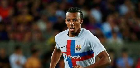 Barcelona's Jules Kounde runs with the ball during a charity friendly soccer match between Barcelona and Manchester City at the Camp Nou stadium in Barcelona, Spain, Wednesday, Aug. 24, 2022. (AP Photo/Joan Monfort)