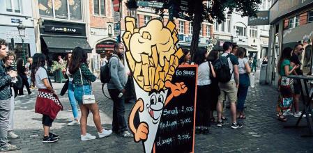 Customers queue outside a friterie in the old town area of Brussels, Belgium, on Monday, Aug. 29, 2022. Belgian inflation hit a 46-Year high of 9.94% as the cost of natural gas more than doubled. Photographer: Cyril Marcilhacy/Bloomberg