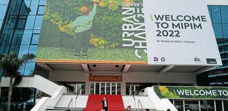 People visit the MIPIM international real estate show for professionals at the Palais des Festivals in Cannes, southeastern France on March 15, 2022. (Photo by Valery HACHE / AFP)