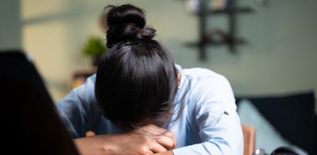 young Business woman sleeping by closing laptop while working, concept of new normal burnout, over or late night work at home during coronavirus covid-19 pandemic.