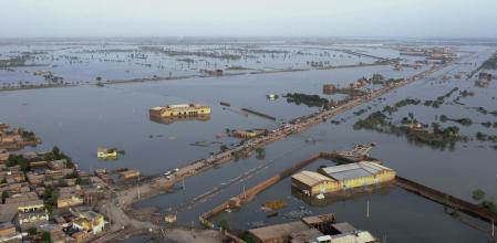 FILE - Homes are surrounded by floodwaters in Sohbat Pur city, a district of Pakistan's southwestern Baluchistan province, Aug. 29, 2022. Loss and damage is the human side of a contentious issue that will likely dominate climate negotiations in Egypt. Extreme weather is worsening as the world warms, with a study calculating that human-caused climate change increased Pakistan’s flood-causing rain by up to 50%. (AP Photo/Zahid Hussain, File)