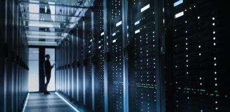 Photo of Out of Focus IT Technician Turning on Data Server.