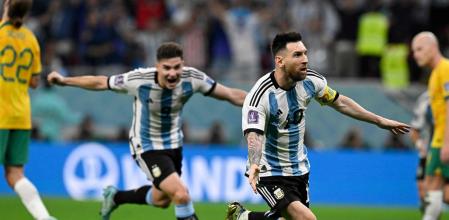 TOPSHOT - Argentina's forward #10 Lionel Messi (2ndR) celebrates with Argentina's forward #09 Julian Alvarez after he scored his team's first goal during the Qatar 2022 World Cup round of 16 football match between Argentina and Australia at the Ahmad Bin Ali Stadium in Al-Rayyan, west of Doha on December 3, 2022. (Photo by Alfredo ESTRELLA / AFP)