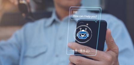 Chatbot assistant conversation, Ai Artificial Intelligence technology concept. Casual man relax chatting with chatbot via mobile smart phone application with speech bubble on virtual screen