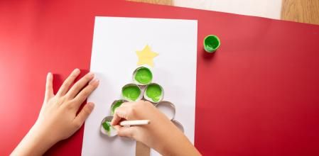 Kid drawing abstract Christmas tree, baby hands drawing, toilet paper roll reuse for child activity