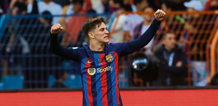 Barcelona's Spanish midfielder Gavi celebrates scoring his team's first goal during the Spanish Super Cup final football match between Real Madrid CF and FC Barcelona at the King Fahd International Stadium in Riyadh, Saudi Arabia, on January 15, 2023. (Photo by Fayez NURELDINE / AFP)