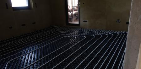 underfloor heating in a house with heating elements embedded in a floor