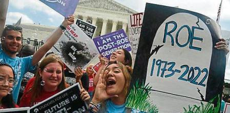 Anti-abortion campaigners celebrate outside the US Supreme Court in Washington, DC, on June 24, 2022. - The US Supreme Court on Friday ended the right to abortion in a seismic ruling that shreds half a century of constitutional protections on one of the most divisive and bitterly fought issues in American political life. The conservative-dominated court overturned the landmark 1973 