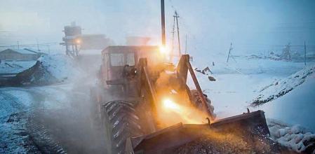 Heating for the town is provided by a coal-fired water heating plant. Every morning this digger delivers fresh coal to the plant & carries away the burnt cinder. RUSSIA'S FROZEN HEART - A journey to Oymyakon, considered by many to be the coldest permanently inhabited settlement in the world. The village was originally a stopover for reindeer herders who would water their flocks from a thermal spring at the location. Known as the
