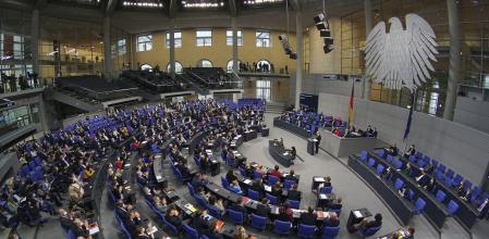 FILE - German Chancellor Olaf Scholz delivers a speech during a meeting of the German federal parliament, Bundestag, at the Reichstag building in Berlin, Germany, Dec. 15, 2021. German lawmakers on Friday approved a reform of the country's voting system that would reduce the size of the increasingly bloated parliament, but two opposition parties were vehemently critical and the plan is likely to face a court challenge. (AP Photo/Michael Sohn, File)