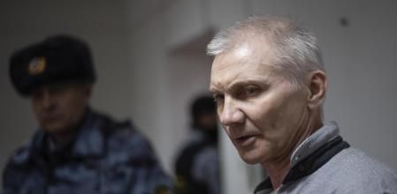 Alexei Moskalyov, right, is escorted from a courtroom in Yefremov, Tula region, some 300 kilometers (186 miles) south of Moscow, Russia, Monday, March 27, 2023. A court in Russia on Tuesday convicted a single father over social media posts criticizing the war in Ukraine and sentenced him to two years in prison — a case brought to the attention of authorities by his daughter's drawings against the invasion at school, according to the man's lawyer and local activists. The 54-year-old Moskalyov, a single father of a 13-year-old daughter, was accused of repeatedly discrediting the Russian army, a criminal offense in accordance to a law Russian authorities adopted shortly after sending troops into Ukraine. (AP Photo)