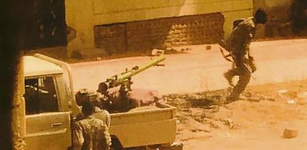 A military vehicle and soldiers said to be from the Sudanese armed forces are seen on a street in Khartoum, Sudan, April 15, 2023 in this picture screen grab obtained from a social media video. Bakri Jad/via REUTERS THIS IMAGE HAS BEEN SUPPLIED BY A THIRD PARTY. NO RESALES. NO ARCHIVES. MANDATORY CREDIT