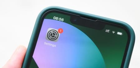 iPhone 13 Pro with notification software update on settings app iOS 15.5 on the screen, new operating system 2022 on iPhone apple devices for download updates : Bangkok, Thailand - May 29 2022