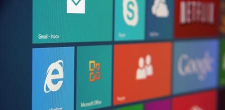 Windows 8 start screen with various tiles shot at an angle.