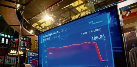 An SVB Financial Group chart displayed on the floor of the New York Stock Exchange in New York, US, on Friday, March 10, 2023. SVB Financial Group shares extended their plunge before being halted in premarket trading for pending news as prominent venture capitalists recommended companies withdraw their money from the lender, sparking further worries over its financial health and liquidity in the wider banking sector. Photographer: Michael Nagle/Bloomberg