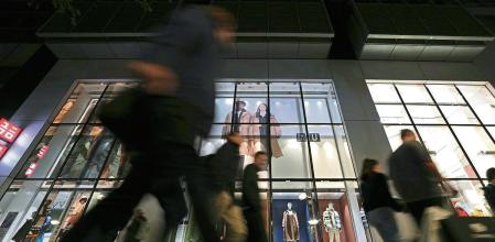 FILE - People walk past a store at the famous shopping road Kurfuerstendamm, better known as 'Kudamm', in Berlin, Germany, on Oct. 11, 2022. Data released Thursday May 25, 2023 by the Federal Statistical Office shows the German economy shrank unexpectedly in the first three months of this year, marking the second quarter of contraction that is one definition of recession. (AP Photo/Michael Sohn, File)