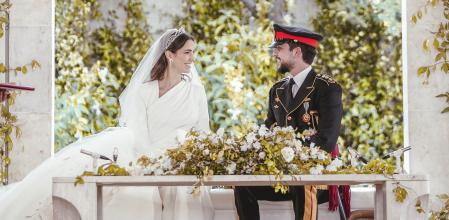 Jordan's Crown Prince Hussein and Rajwa Alseif sit during the wedding ceremony in Amman, Jordan, Thursday, June 1, 2023. (Royal Hashemite Court via AP)