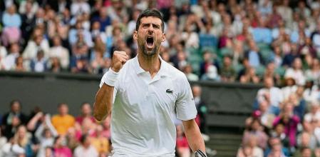 Serbia's Novak Djokovic celebrates winning a point against Russia's Andrey Rublev in a men's singles match on day nine of the Wimbledon tennis championships in London, Tuesday, July 11, 2023. (AP Photo/Kirsty Wigglesworth)
