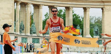 BUDAPEST, HUNGARY - AUGUST 19: Alvaro Martin of Team Spain crosses the finish line to win the Men's 20km Race Walk Final during day one of the World Athletics Championships Budapest 2023 at National Athletics Centre on August 19, 2023 in Budapest, Hungary. (Photo by Michael Steele/Getty Images)