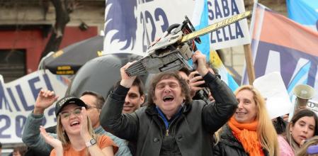 Picture released by AG La Plata showing the presidential candidate for La Libertad Avanza party, Javier Milei (C), waving a chainsaw between his sister Karina Milei (R) and Buenos Aires Province governor candidate Carolina Piparo, during a political rally in La Plata, Buenos Aires Province, Argentina, on September 12, 2023. Argentina holds presidential elections on October 22, 2023. With a month to go, the election remains eminently open and the economy at the heart of the debates, with a great divide between the ultraliberal Javier Milei's promise to 