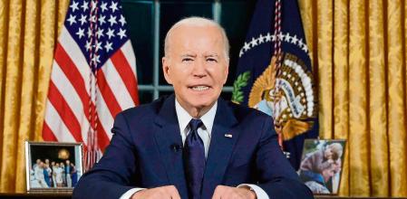 US President Joe Biden addresses the nation on the conflict between Israel and Gaza and the Russian invasion of Ukraine from the Oval Office of the White House in Washington, DC, on October 19, 2023. President Joe Biden will deliver a rare Oval Office speech October 19, 2023 urging Americans to back military aid for Israel and Ukraine at what he calls a perilous moment for democracy around the globe. (Photo by JONATHAN ERNST / POOL / AFP)