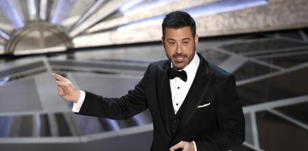 FILE - Host Jimmy Kimmel speaks at the Oscars in Los Angeles on March 4, 2018. Kimmel is returning as host of the Academy Awards, the Academy of Motion Pictures Arts and Sciences announced Wednesday. (Photo by Chris Pizzello/Invision/AP, File)