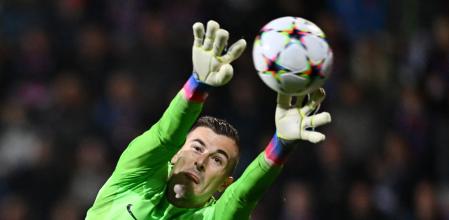 Barcelona's Spanish goalkeeper Inaki Pena jumps to save the ball during the UEFA Champions League Group C football match FC Viktoria Plzen v FC Barcelona in Plzen, Czech Republic, on November 1, 2022. (Photo by Joe Klamar / AFP)