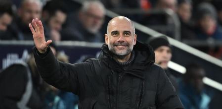 Manchester City's Spanish manager Pep Guardiola reacts during the English Premier League football match between Luton Town and Manchester City at Kenilworth Road in Luton, north of London on December 10, 2023. (Photo by JUSTIN TALLIS / AFP) / RESTRICTED TO EDITORIAL USE. No use with unauthorized audio, video, data, fixture lists, club/league logos or 'live' services. Online in-match use limited to 120 images. An additional 40 images may be used in extra time. No video emulation. Social media in-match use limited to 120 images. An additional 40 images may be used in extra time. No use in betting publications, games or single club/league/player publications. /