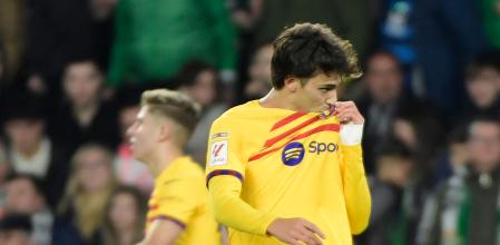 Barcelona's Portuguese forward #14 Joao Felix celebrates scoring his team's third goal during the Spanish League football match between Real Betis and FC Barcelona at the Benito Villamarin stadium in Seville on January 21, 2024. (Photo by CRISTINA QUICLER / AFP)