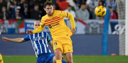 Alaves' Spanish midfielder #18 Jon Guridi tackles Barcelona's Danish defender #15 Andreas Christensen during the Spanish league football match between Deportivo Alaves and FC Barcelona at the Mendizorroza stadium in Vitoria on February 3, 2024. (Photo by Ander Gillenea / AFP)